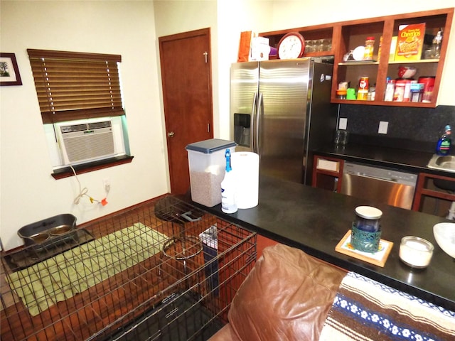 1075 County Road 436, Eastland, TX 76448 - kitchen featuring appliances with stainless steel finishes, cooling unit, and dark countertops