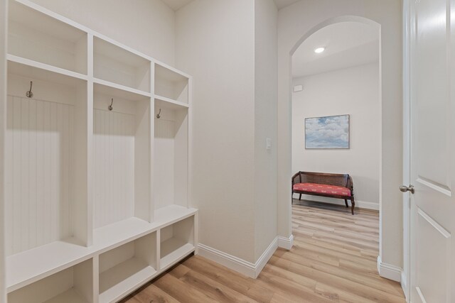 233 Observation Dr N, Aledo, TX 76008 - mudroom featuring arched walkways, light wood-type flooring, and baseboards