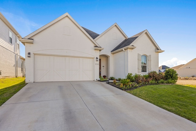 233 Observation Dr N, Aledo, TX 76008 - french provincial home with brick siding, a front lawn, driveway, and an attached garage