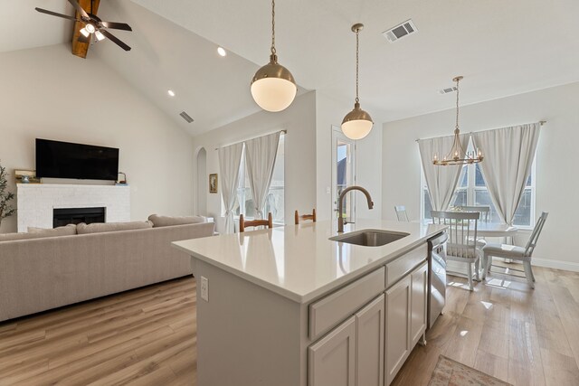 233 Observation Dr N, Aledo, TX 76008 - kitchen with a sink, open floor plan, light wood-type flooring, stainless steel dishwasher, and high vaulted ceiling