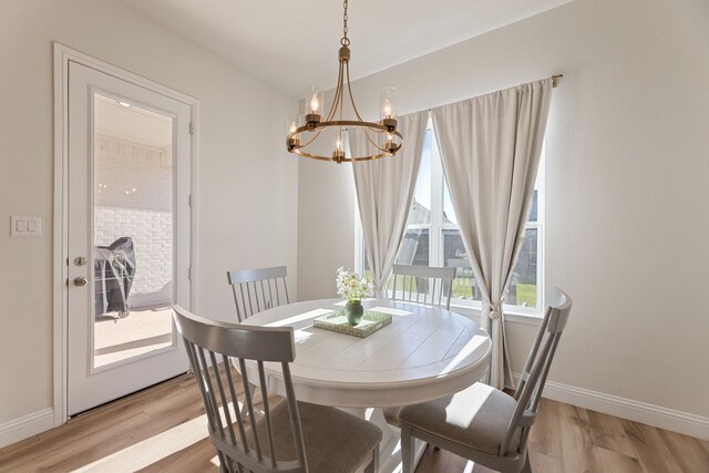 233 Observation Dr N, Aledo, TX 76008 - dining area with a chandelier, light wood-style flooring, and baseboards