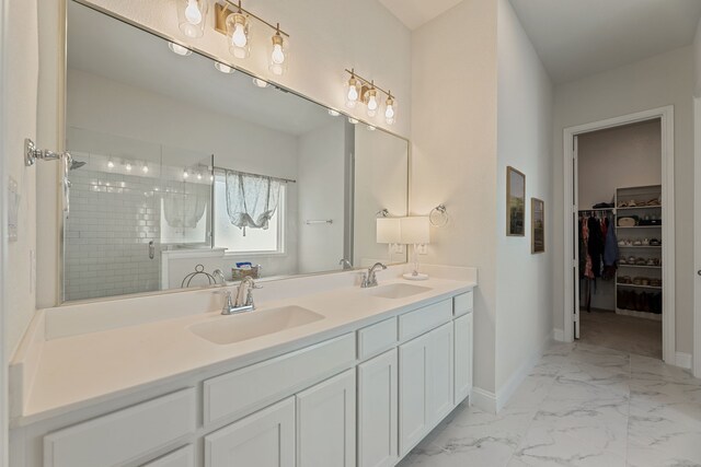 233 Observation Dr N, Aledo, TX 76008 - full bathroom featuring marble finish floors, a stall shower, double vanity, baseboards, and a spacious closet