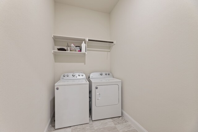 233 Observation Dr N, Aledo, TX 76008 - laundry area with washer and dryer, baseboards, and light marble finish floors