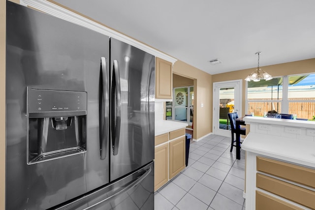 318 Cecile Ct, Arlington, TX 76013 - kitchen with stainless steel fridge with ice dispenser, light countertops, light tile patterned floors, a chandelier, and hanging light fixtures