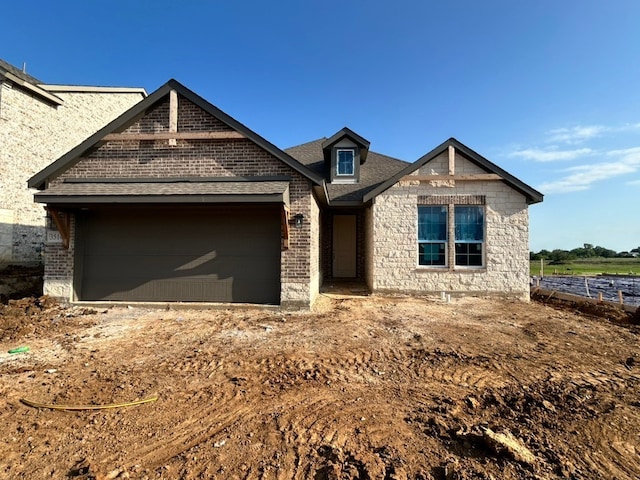 3514 Columbus St, Gainesville, TX 76240 - view of front of home with an attached garage and brick siding