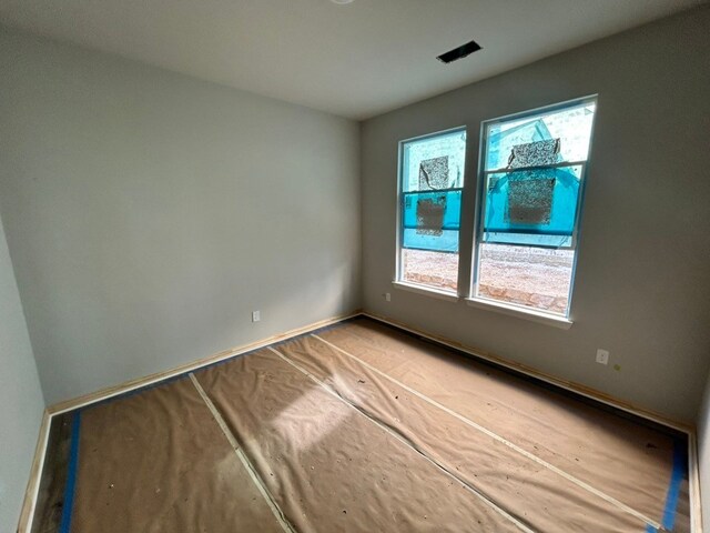 3514 Columbus St, Gainesville, TX 76240 - empty room with plenty of natural light and baseboards