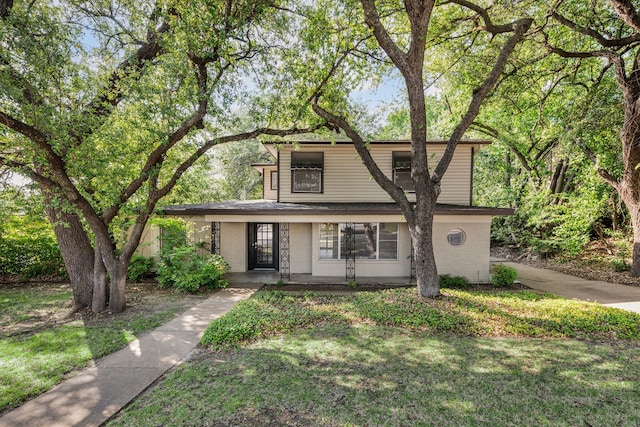 6455 Waverly Way, Fort Worth, TX 76116 - mid-century inspired home featuring a porch and a front yard