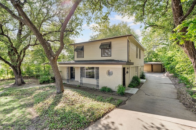 6455 Waverly Way, Fort Worth, TX 76116 - traditional-style home featuring a porch, brick siding, an outdoor structure, and driveway