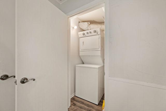 6455 Waverly Way, Fort Worth, TX 76116 - laundry room featuring stacked washer / dryer and wood finished floors