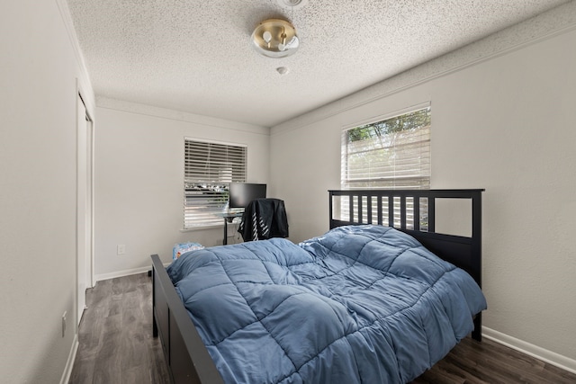 6455 Waverly Way, Fort Worth, TX 76116 - bedroom featuring wood finished floors, a textured ceiling, and baseboards