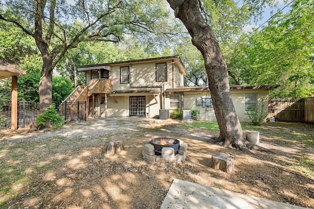 6455 Waverly Way, Fort Worth, TX 76116 - back of property featuring a fire pit, cooling unit, and a patio area