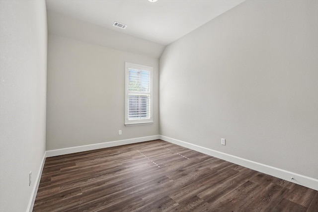 7802 Lindsey Dr, Rowlett, TX 75088 - spare room with dark wood-style flooring, baseboards, and vaulted ceiling