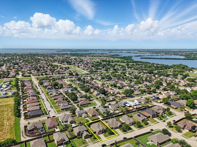 7802 Lindsey Dr, Rowlett, TX 75088 - aerial view of residential area with a large body of water and property boundaries highlighted