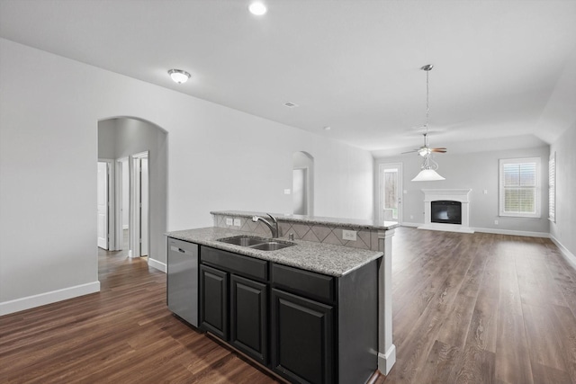 7802 Lindsey Dr, Rowlett, TX 75088 - kitchen featuring a sink, arched walkways, ceiling fan, and dishwasher