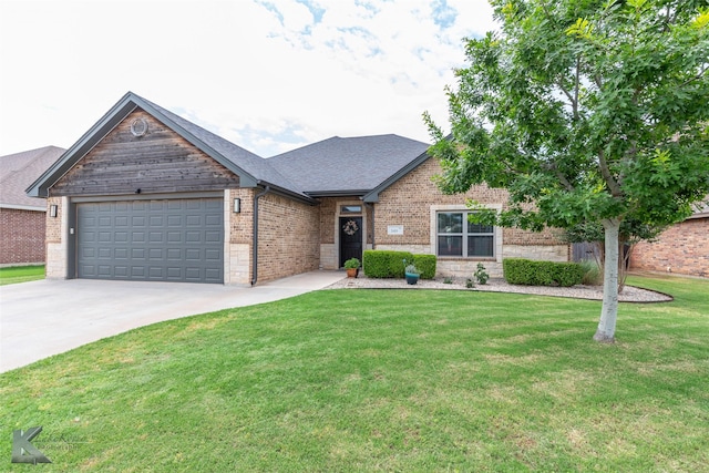 349 Mill Creek Dr, Abilene, TX 79602 - view of front of house with an attached garage, a front lawn, brick siding, concrete driveway, and roof with shingles