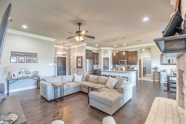 349 Mill Creek Dr, Abilene, TX 79602 - living area with a ceiling fan, dark wood-style flooring, recessed lighting, baseboards, and crown molding