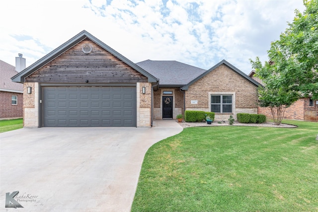 349 Mill Creek Dr, Abilene, TX 79602 - view of front of property featuring brick siding, concrete driveway, a front lawn, and a garage