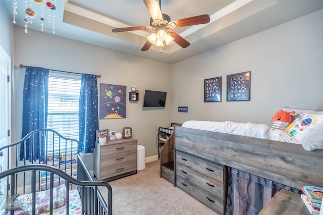 349 Mill Creek Dr, Abilene, TX 79602 - bedroom featuring carpet, ornamental molding, baseboards, ceiling fan, and a tray ceiling