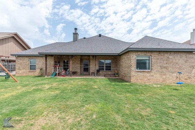 349 Mill Creek Dr, Abilene, TX 79602 - back of house with a chimney, brick siding, and a patio area