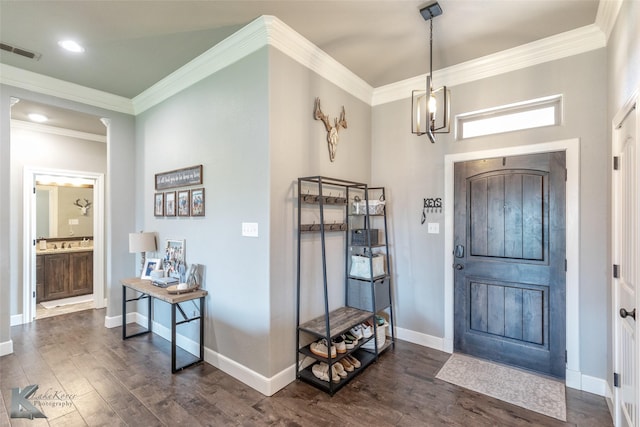 349 Mill Creek Dr, Abilene, TX 79602 - foyer featuring ornamental molding, dark wood-type flooring, baseboards, a chandelier, and recessed lighting