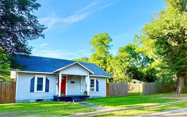 401 Ash St, Teague, TX 75860 - view of front of home featuring covered porch, roof with shingles, and cooling unit