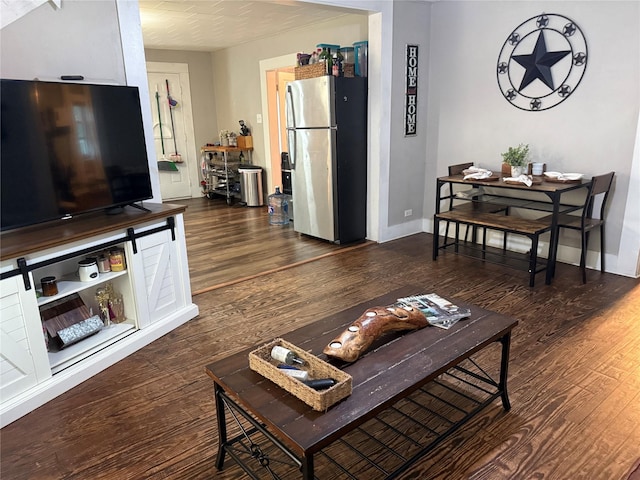 401 Ash St, Teague, TX 75860 - living room featuring wood finished floors and baseboards