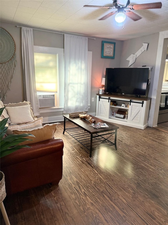 401 Ash St, Teague, TX 75860 - living area featuring a ceiling fan, cooling unit, and wood finished floors