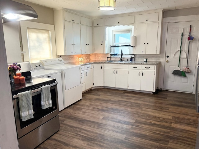401 Ash St, Teague, TX 75860 - kitchen with a sink, washing machine and dryer, stainless steel electric stove, and backsplash
