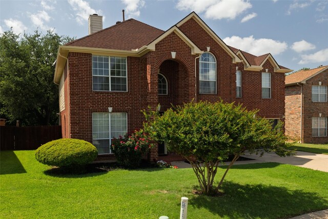 5732 Chelmsford Trl, Arlington, TX 76018 - view of front of house featuring brick siding, a garage, driveway, and a front yard