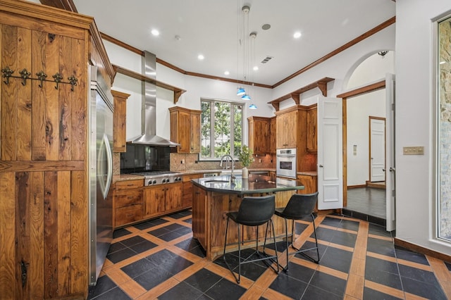 1 Hamper Ct, Trophy Club, TX 76262 - kitchen with appliances with stainless steel finishes, a sink, brown cabinetry, ornamental molding, and inlaid floor details