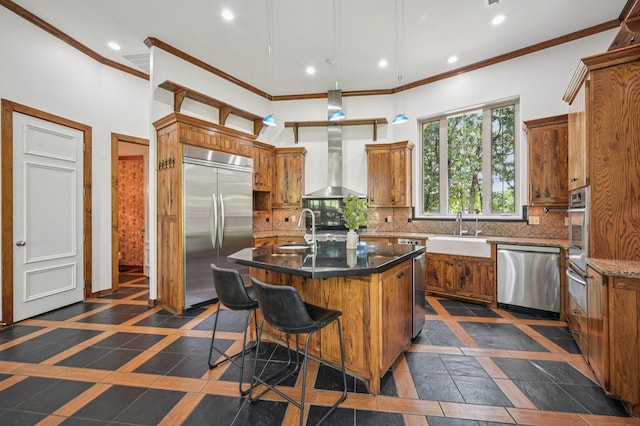 1 Hamper Ct, Trophy Club, TX 76262 - kitchen featuring appliances with stainless steel finishes, a sink, inlaid floor details, brown cabinetry, and crown molding
