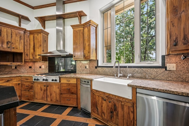 1 Hamper Ct, Trophy Club, TX 76262 - kitchen featuring stainless steel appliances, a sink, inlaid floor details, wall chimney exhaust hood, and brown cabinetry