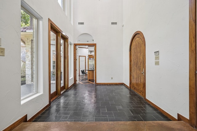 1 Hamper Ct, Trophy Club, TX 76262 - entryway with baseboards, arched walkways, and a high ceiling