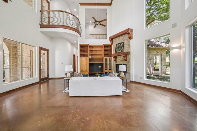 1 Hamper Ct, Trophy Club, TX 76262 - living room featuring a high ceiling, baseboards, concrete flooring, and ceiling fan