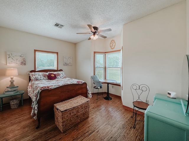 1665 Fm 2452, Corsicana, TX 75110 - bedroom with wood finished floors, a textured ceiling, a ceiling fan, and baseboards
