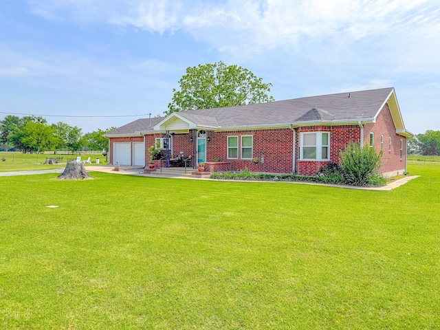 1665 Fm 2452, Corsicana, TX 75110 - ranch-style home with brick siding, a front yard, a garage, and concrete driveway