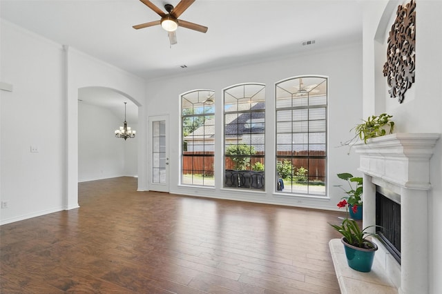 7602 Bridge Water Cir, Frisco, TX 75034 - unfurnished living room featuring a high end fireplace, ceiling fan, healthy amount of natural light, a chandelier, and ornamental molding