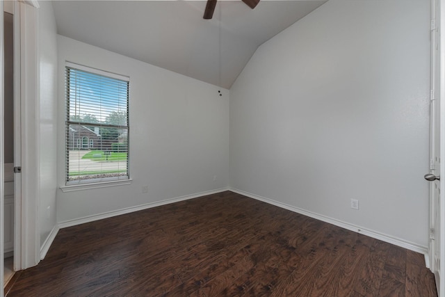 7602 Bridge Water Cir, Frisco, TX 75034 - spare room featuring vaulted ceiling, a ceiling fan, dark wood-type flooring, and baseboards