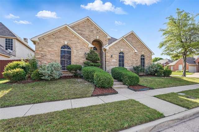 7602 Bridge Water Cir, Frisco, TX 75034 - traditional-style home featuring brick siding and a front yard