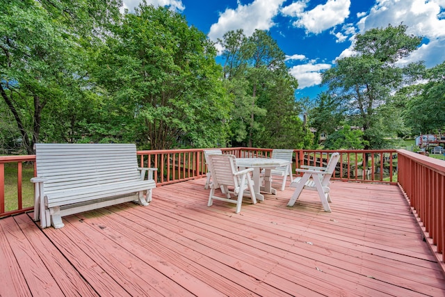 164 Harbor Dr, Gun Barrel City, TX 75156 - wooden deck featuring outdoor dining area and view of scattered trees