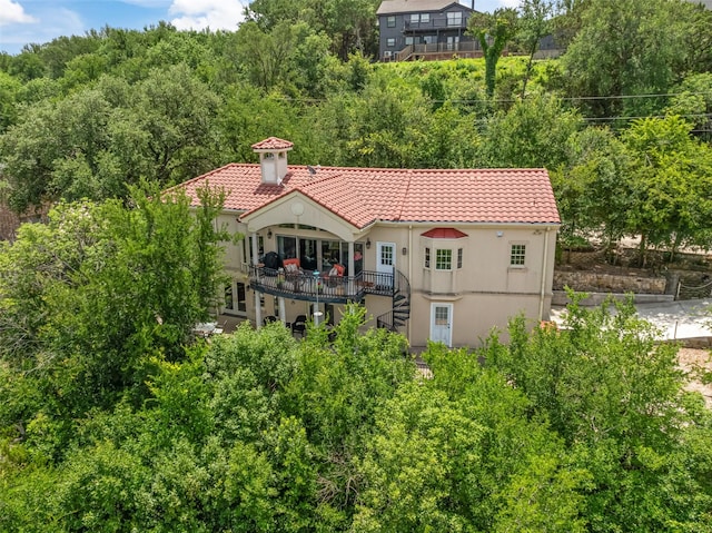 2510 River Ridge Court, Granbury, TX 76048 - back of house with a tiled roof, stairs, and stucco siding