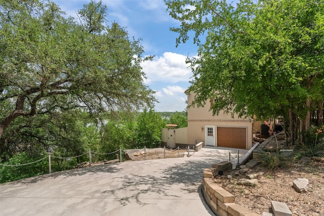 2510 River Ridge Court, Granbury, TX 76048 - view of front of property with concrete driveway, stucco siding, and a garage