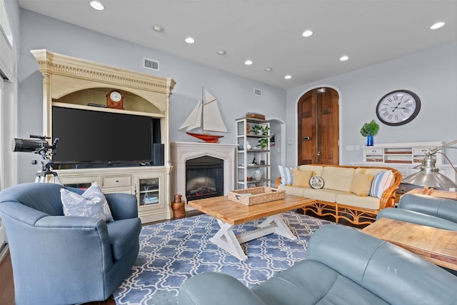 2510 River Ridge Court, Granbury, TX 76048 - living area with recessed lighting, arched walkways, and a fireplace