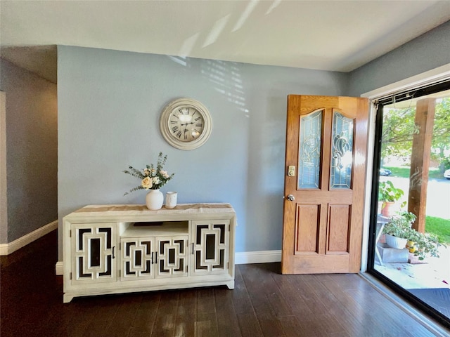 2217 Linwood Ln, Irving, TX 75061 - entryway with baseboards and dark wood-type flooring