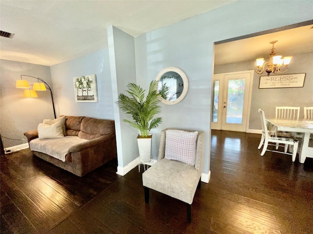 2217 Linwood Ln, Irving, TX 75061 - living room with a chandelier, hardwood / wood-style flooring, and baseboards