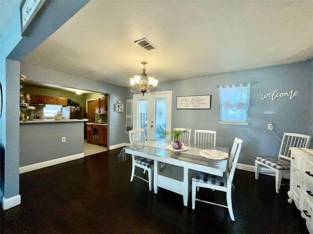 2217 Linwood Ln, Irving, TX 75061 - dining room featuring a chandelier, french doors, baseboards, and wood finished floors