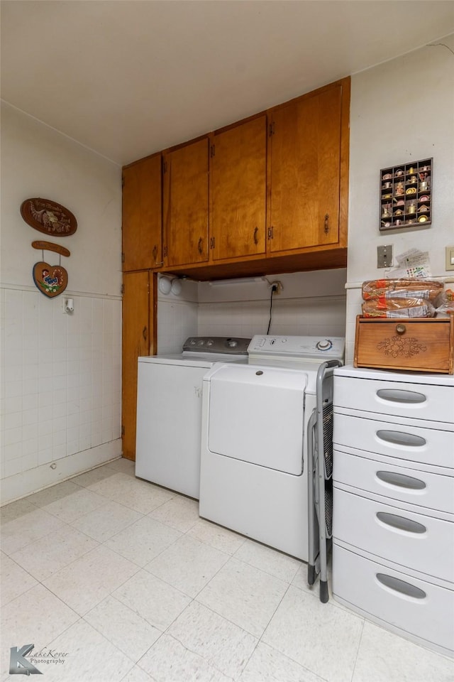 1541 S 9th St, Abilene, TX 79602 - laundry room with cabinet space, washer and clothes dryer, and a wainscoted wall