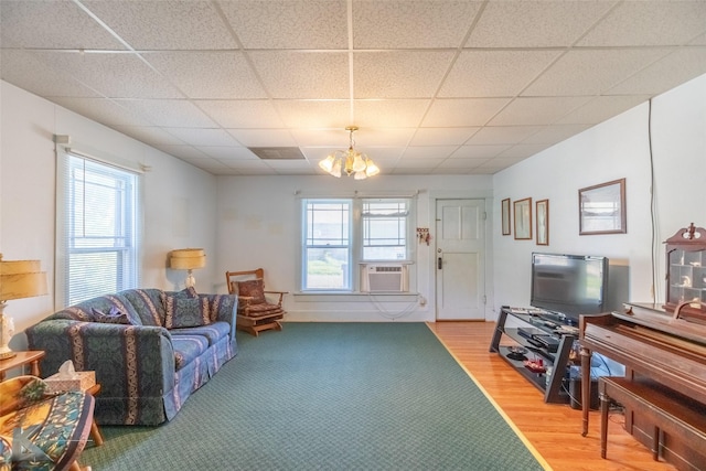 1541 S 9th St, Abilene, TX 79602 - living room featuring plenty of natural light, a chandelier, a drop ceiling, light wood-style floors, and cooling unit