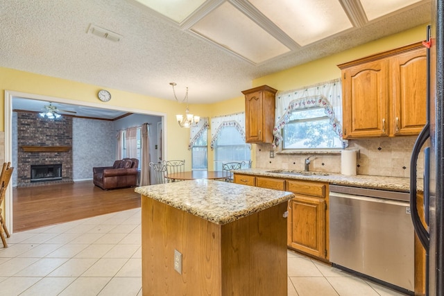 2816 Wateridge Ct, Grapevine, TX 76051 - kitchen featuring stainless steel dishwasher, a sink, a center island, open floor plan, and light tile patterned flooring