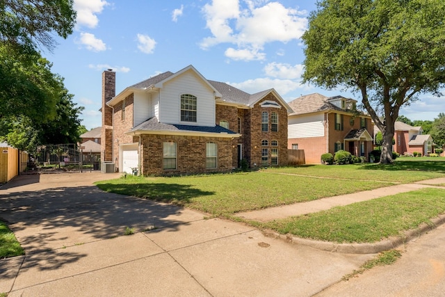 2816 Wateridge Ct, Grapevine, TX 76051 - view of front of house with a chimney, an attached garage, driveway, brick siding, and central AC unit